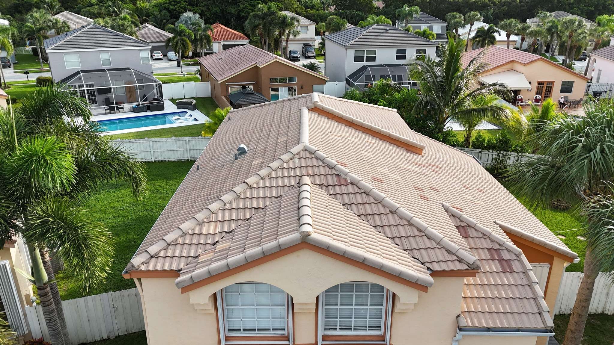 Aerial view of suburban homes with tiled roofs